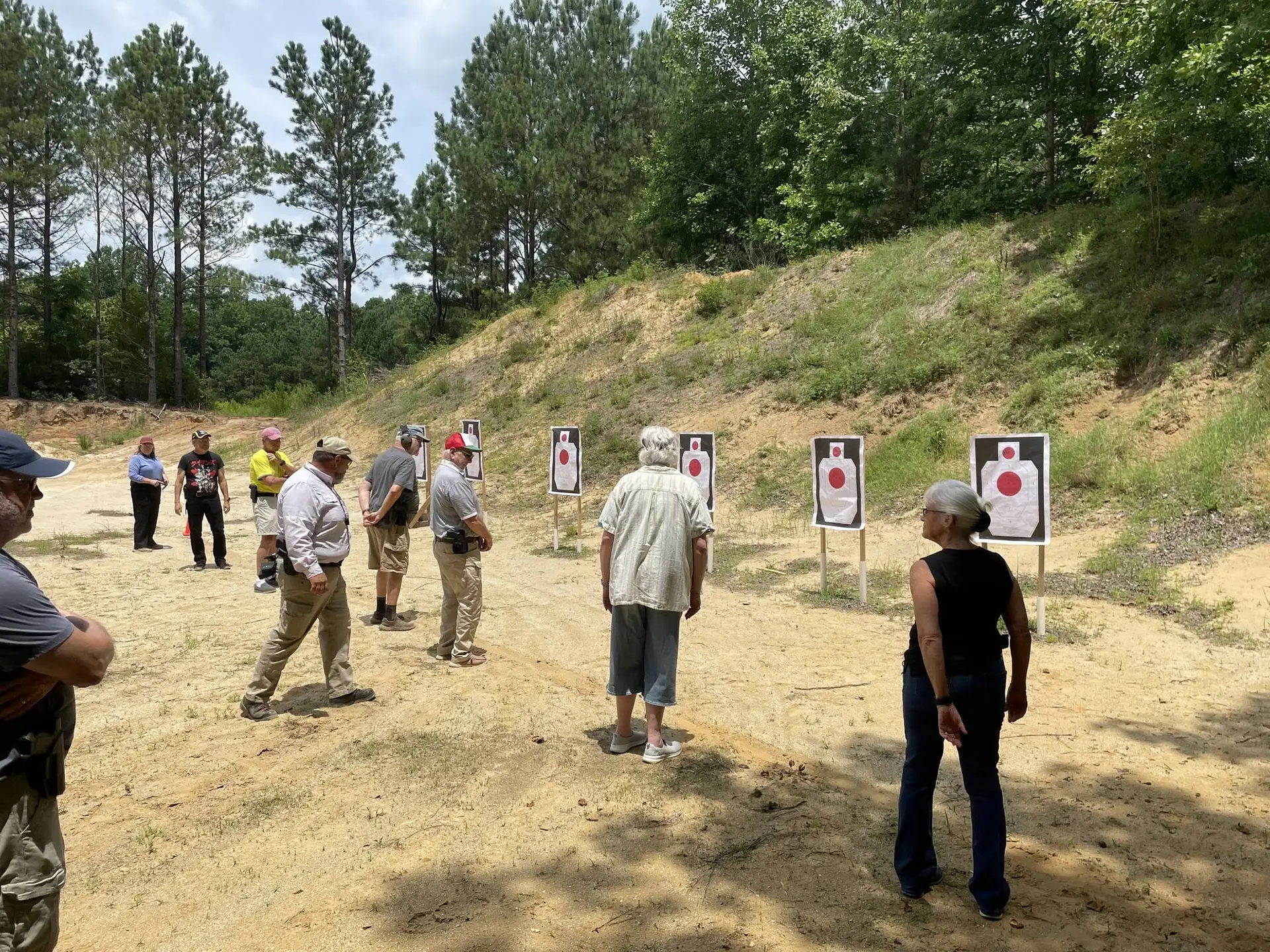Instructor giving directions to shooters on the pistol range